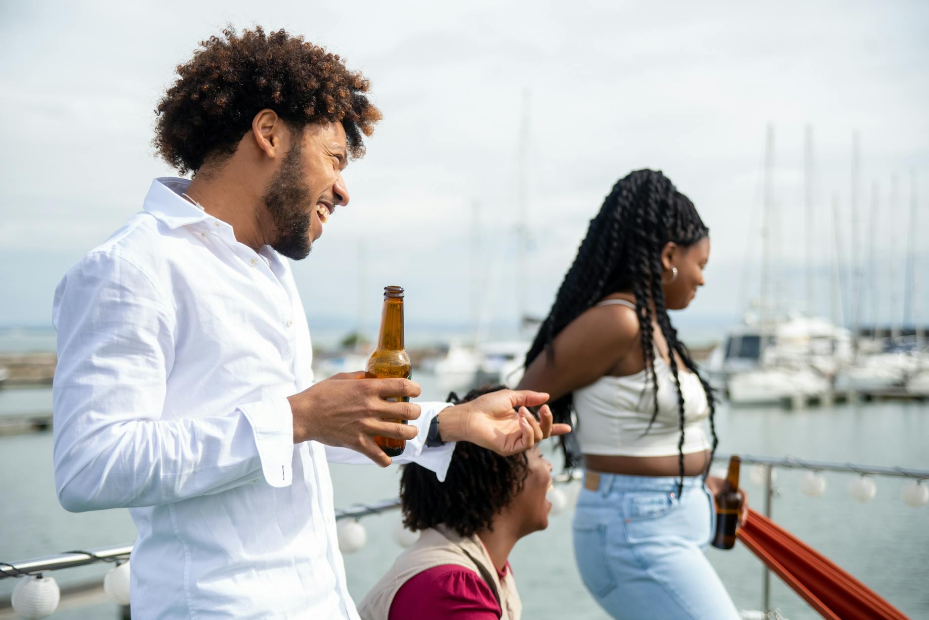 Group of friends enjoying a private boat trip in summer